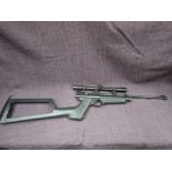 A Crossman .22 calibre air rifle with scope sight, numbered 214BO2874, with case