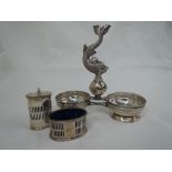 A Spanish silver hors d'oeuvre stand having a moulded dolphin central handle between two bowls