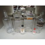 A selection of glass pharmacy bottles and jars, various