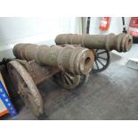 Two replica cannons on metal gun carriages, barrel length 24' with impressed design on barrels, very