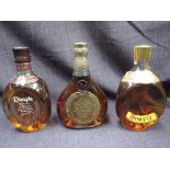 Three bottles of whisky. Dimple 15 year old, 40%, 75cl, Dimple Deluxe, 70% proof, 26 2/3 fl oz and