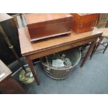 A 19th century mahogany tea table having rectangular top on tapered gate legs