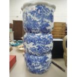 An eaarly 20th century Japanese vase/stickstand of bobbin form having blue and white pictorial