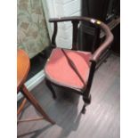 An Edwardian mahogany corner chair having shaped frame and cabriole legs