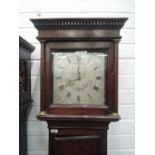 A late 18th century oak longcase clock having square pillar hood containing silver dial and 30