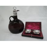 A Victorian brown glass claret jug having a silver mount, spout and stopper, Birmingham hallmark,
