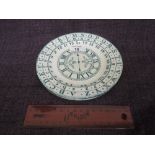 A 19th century Staffordshire plate by B & K of numerical school clock design