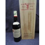 A bottle of rare Old Highland malt whisky, blended and bottled by Chas Mackinlay and Co,