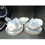 A selection of vintage tea cups and saucers with transfer print