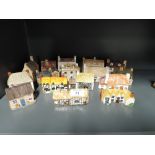 A selection of decorative ceramic houses similar to Lilliput lane