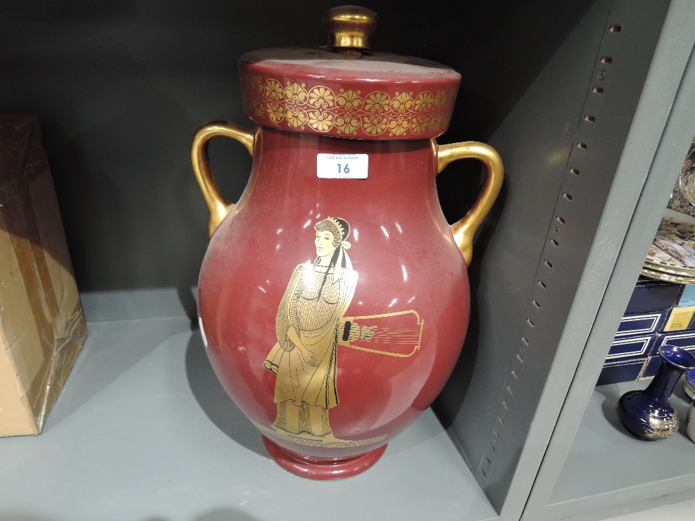 A large lidded urn with twin handle and Greek style design marked G.A.C Stoke on trent to base