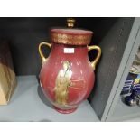 A large lidded urn with twin handle and Greek style design marked G.A.C Stoke on trent to base