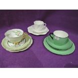 A selection of vintage tea cups and saucers including hand decorated set by E. Lowcock