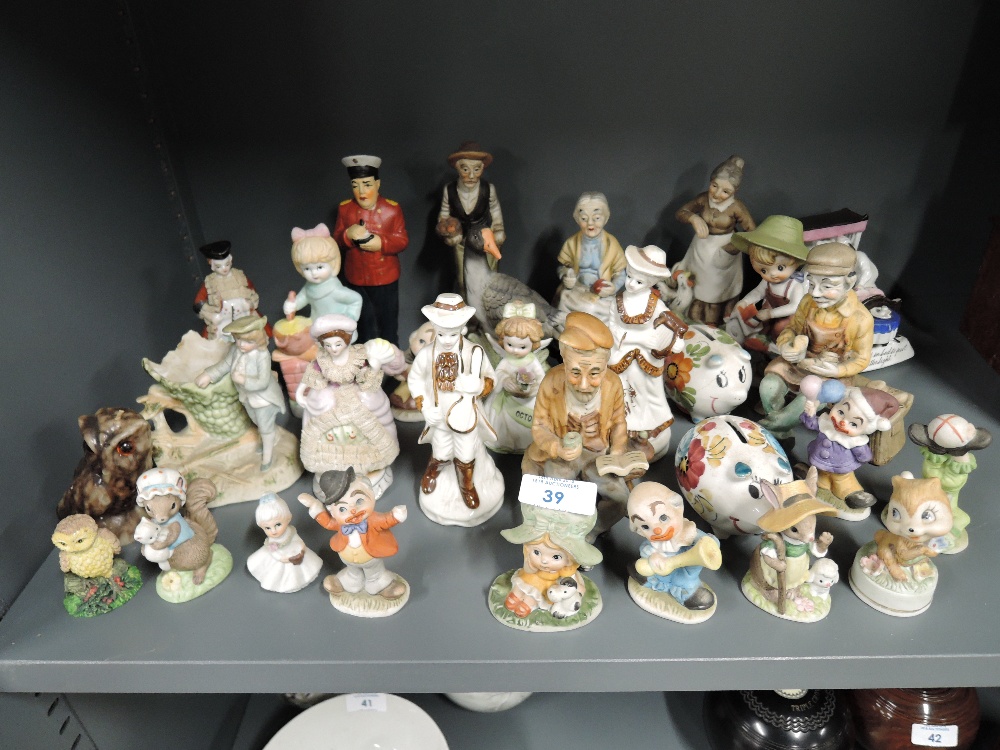 A selection of mixed figures and figurines