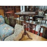 A mahogany wine table on triple splayed feet