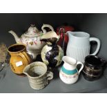 A selection of vintage ceramics including tea pots and jugs etc