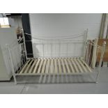 A reproduction metal frame daybed