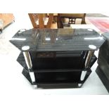 A black glass TV stand