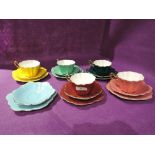 A selection of vintage tea cups and saucers in a harlequin design by Royal Stuart Spencer Stevenson