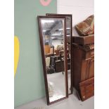 A modern mahogany effect mirror