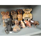 A large selection of wooden treen carved figures and figurines including African animals