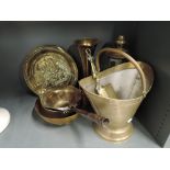 A selection of vintage brass objects including small sauce pan