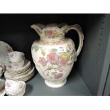 A large vintage ceramic wash jug with floral transfer print