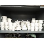 A large selection of tea cups saucers and teapots etc by Poole pottery 50 pieces approx