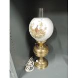 A vintage oil burning gas lamp with milk glass shade and pheasant print
