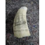 A piece of nautical scrimshaw horn marked Monmouth 1851