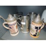 A selection of vintage steel and ceramic musical tankards