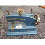 A vintage childs toy sewing machine Vulcan junior