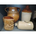 A selection of salt glazed earthen ware and stone ware advertising flagon