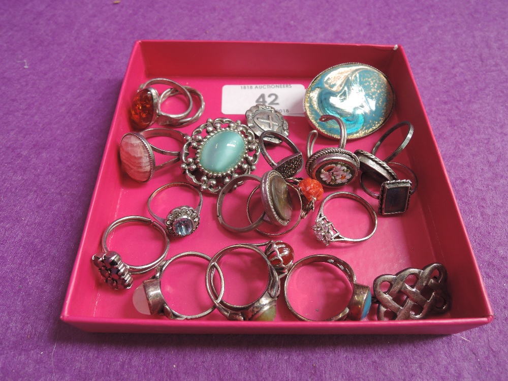 A small selection of white metal dress rings etc