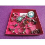 A small selection of white metal dress rings etc