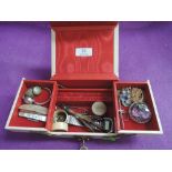 A small vintage jewellery box containing a small selection of costume jewellery including mother