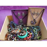 A box of modern costume jewellery including beads, bangles etc