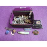 A small leather case containing a selection of misc including folding penknife with HM silver blade,