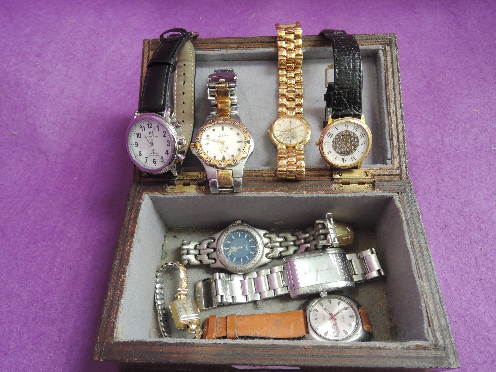 A small wooden box containing eight wrist watches including Zeitner, Everite ewtc