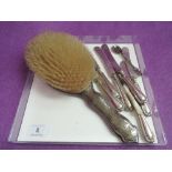 A small selection of HM silver including a hair brush with plannished decoration, silver handled