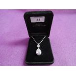 A cubic zirconia double drop pendant in a silver mount on silver chain