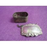 An HM silver Sherry decanter label and an HM silver napkin ring having engine turned decoration