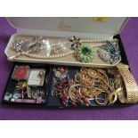 A selection of costume jewellery including brooches, chains, cufflinks etc