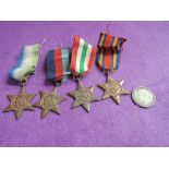 Four WWII medals including the Atlantic star, Burma star and Italian star