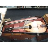 A late 19th/early 20th Century traditional bowl back mandolin, bearing label for Augustus Busch,