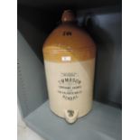 A vintage salt glazed earthen ware flagon for T W Mason Temperance brewer of Kendal