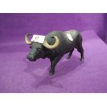 A vintage figurine study of a water buffalo by Coalport