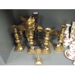 A selection of various candles sticks brass and treen etc