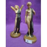 A pair of art deco styled figures as semi clad maiden