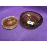 Two amber glass control bubble trinket dishes in a white friars style